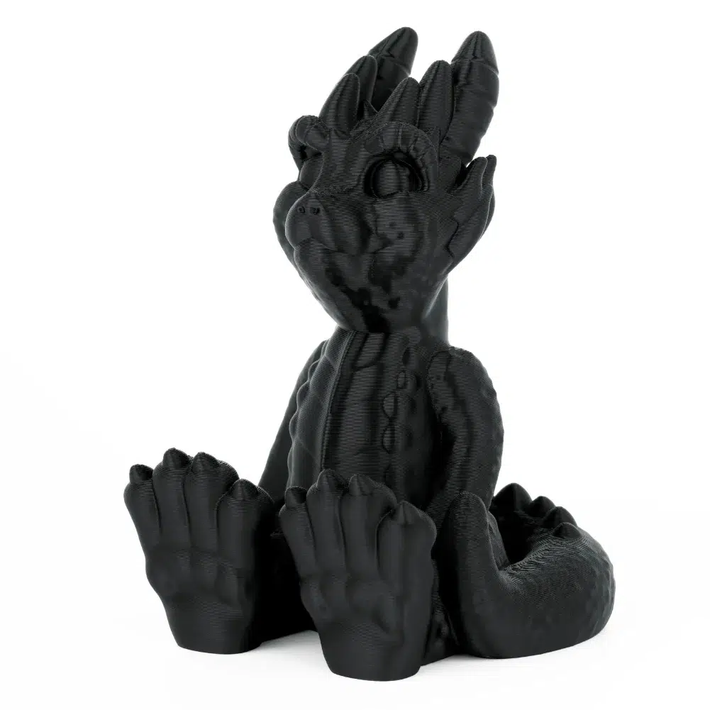 Gray PLA sample print showing smooth layer lines on a curved surface.