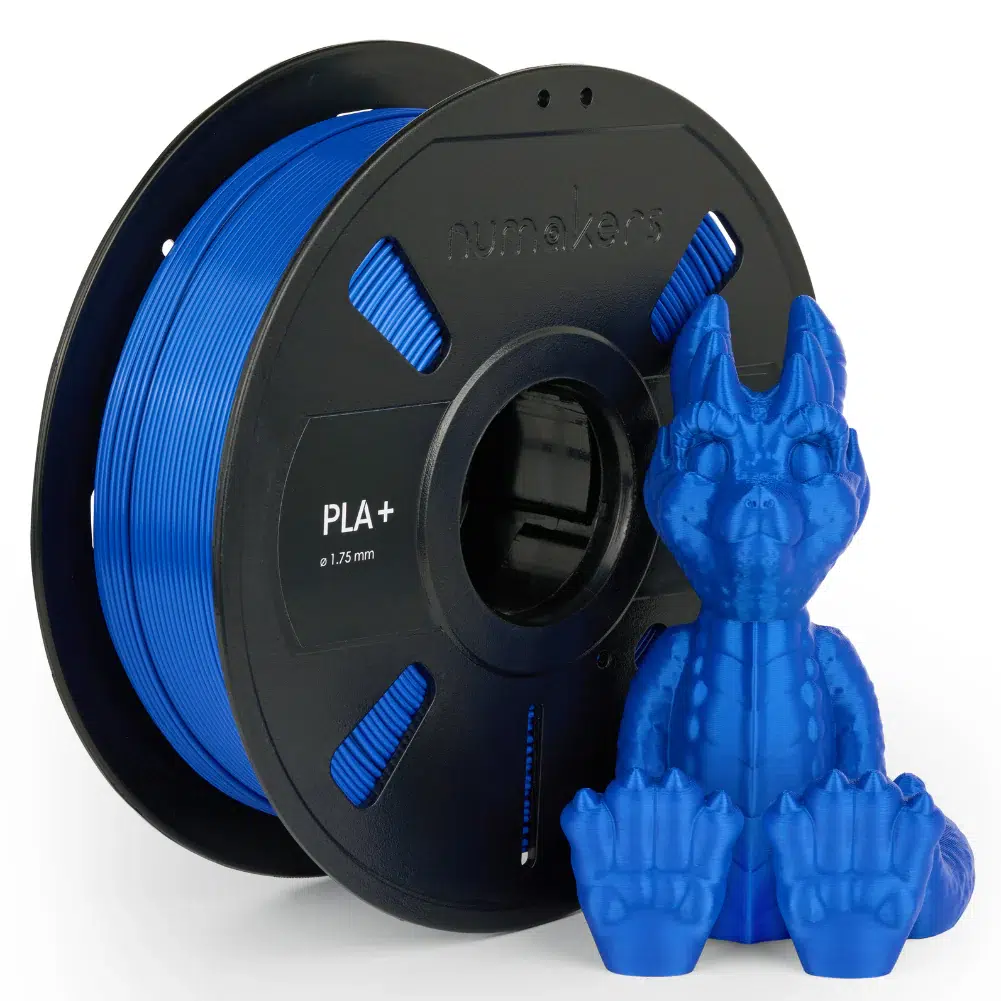Spool of PLA filament and a white 3D printed model of a castle.